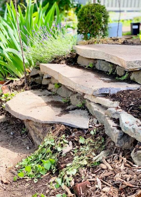 Rustic stone garden steps built into a landscaped hillside