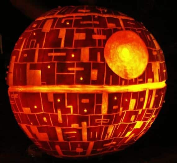 Pumpkin carved and lit to look like the Star Wars Death Star.